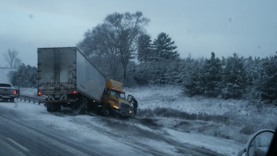 Truck on side of the road with frame damage