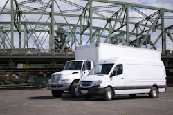 Two leasing trucks parked in a lot