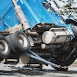 blue semi-truck being flipped