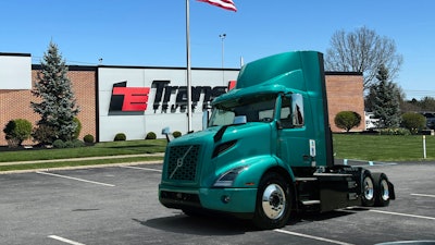 Volvo VNR electric truck in front of TransEdge dealer