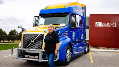 Carmen Anderson, America’s Service Line professional driver, and the Volvo VNL760 that she’ll now be operating to help raise awareness and support of Special Olympics.