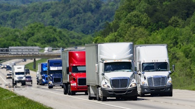 A variety of Class 8 trucks on the highway