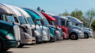 Class 8 trucks parked in row