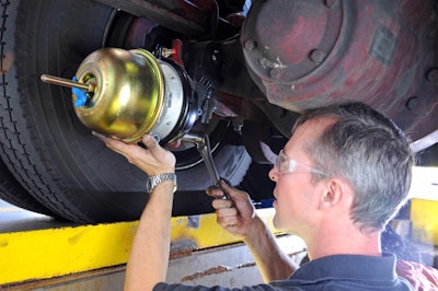 Bendix technician prepares to measure free play and brake stroke