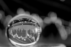 Crystal ball with chart inside for market conditions