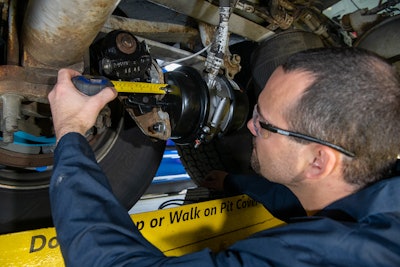 Bendix technician working on a wheel end