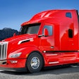 Red Peterbilt Model 579 on the highway