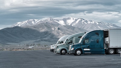 Three trucks parked in rest area in Rocky Mountains