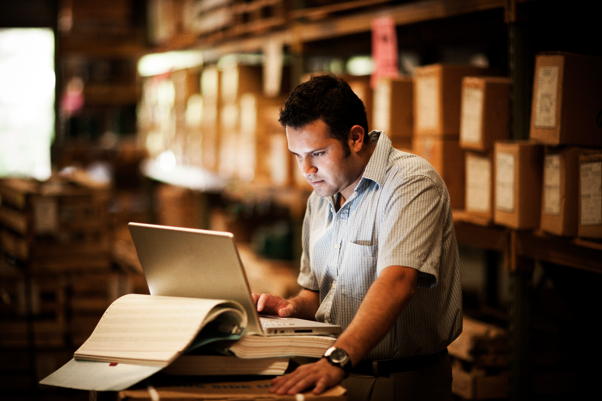 Warehouse worker on a laptop