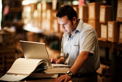 Warehouse worker on a laptop