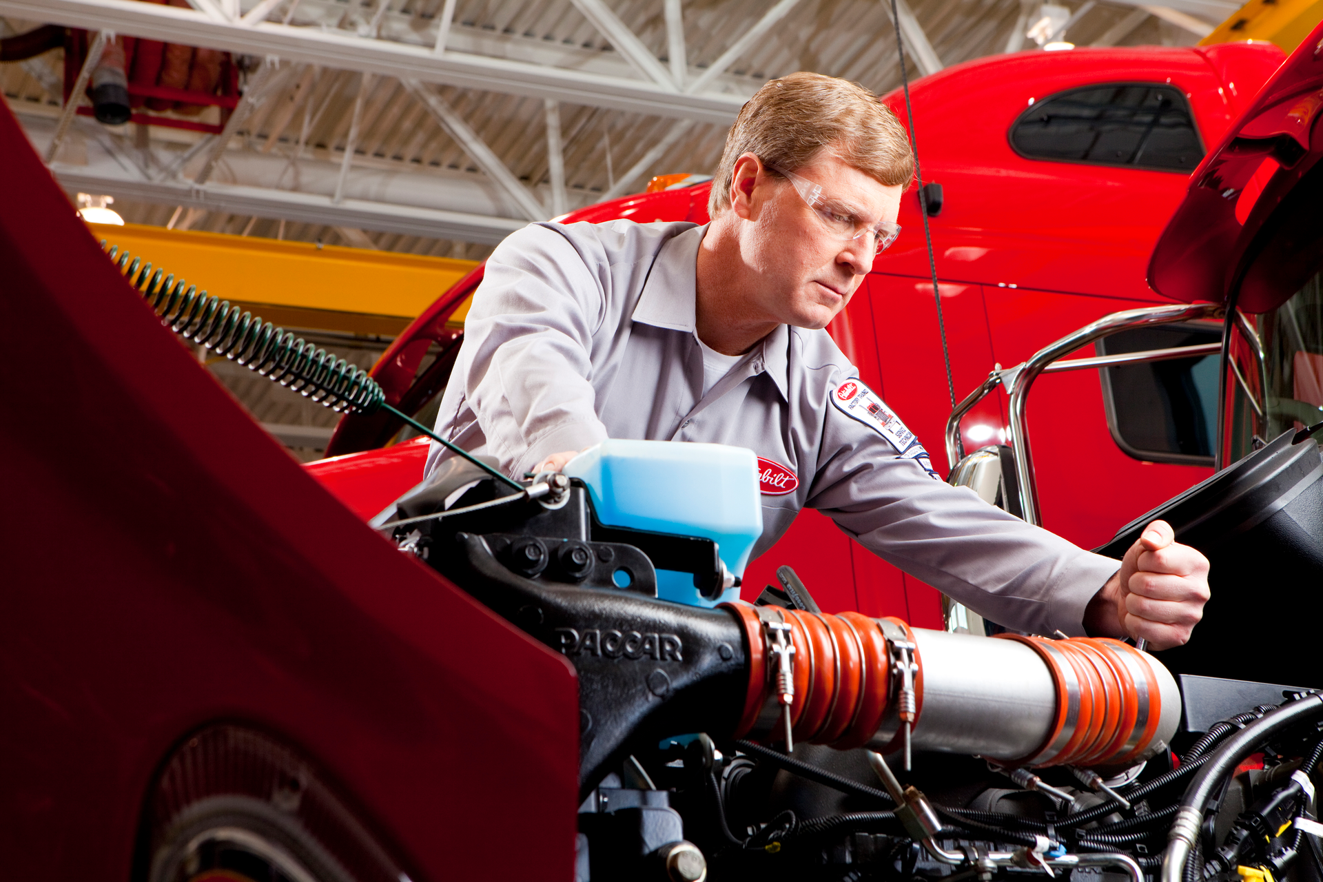 Paccar technician working on engine