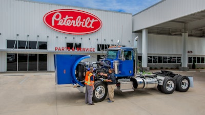 The Pete Store employees diagnosing a truck.