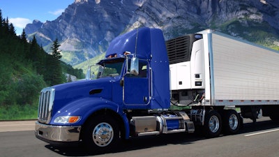 Reefer truck with Carrier Transicold unit attached to trailer.