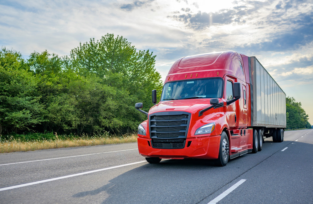 Class 8 truck driving down the road.
