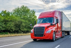 Class 8 truck driving down the road.
