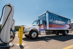 International electric truck at charging station.
