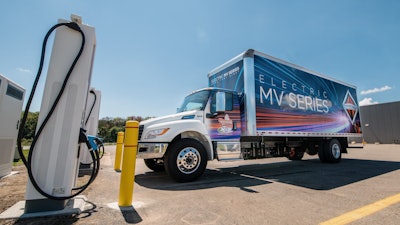 International electric truck at charging station.