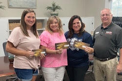 Four Star Freightliner employee Lee Barnard presents Lynn Etheredge, Mary Beth Morris and Michelle Brooks with $250 gift cards. They are all teachers at Baconton Community Charter School in Baconton, Ga.