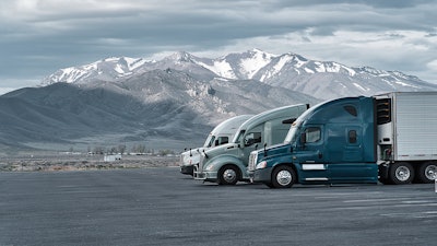 Three trucks parked in rest area in Rocky Mountains