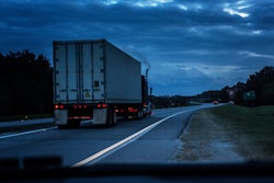 Truck on road with smoke