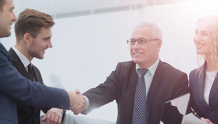 Men shaking hands after business deal
