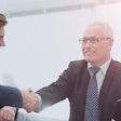 Men shaking hands after business deal