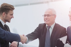 Men shaking hands after business deal
