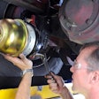 Bendix technician working under truck.