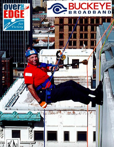 Marc Karon rappels down a building at the 'Over the Edge' charity event for The Victory Center, a cancer patient support charity.