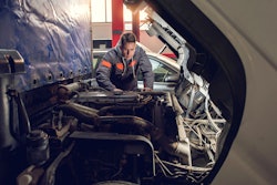 Technician looking at truck