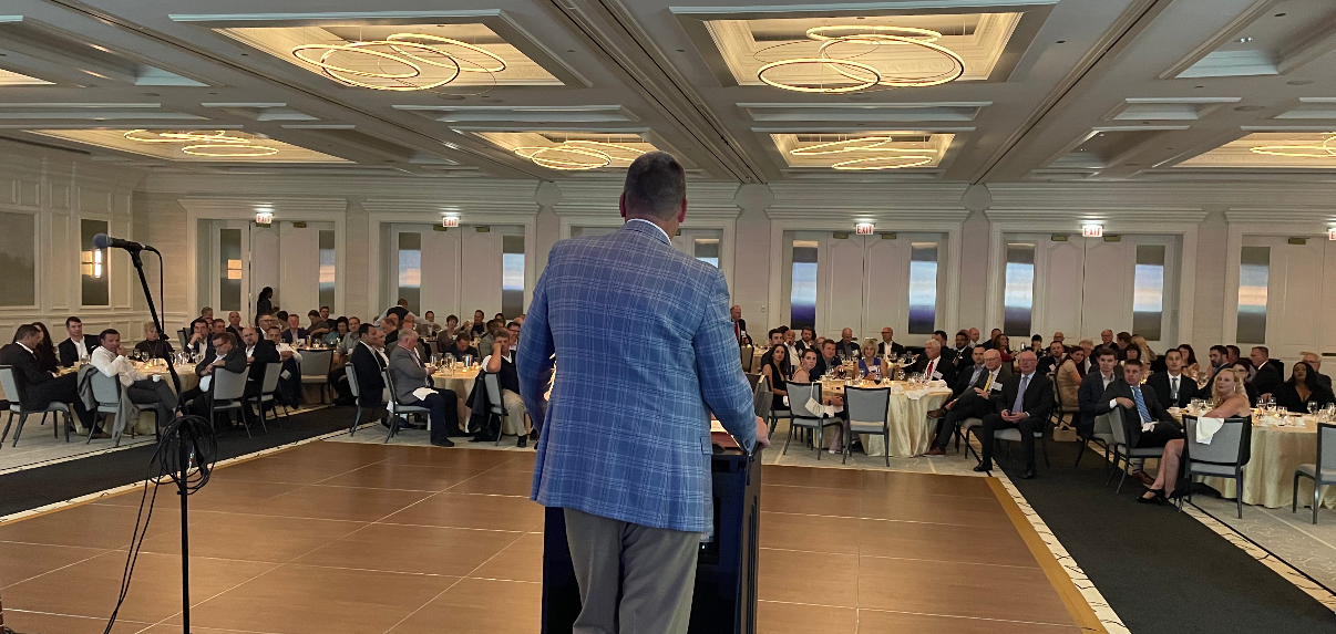 NationaLease president Dean Vicha speaking at company's annual meeting