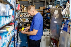 Technician looking for a part in storage