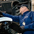 Transervice technician at work on a truck