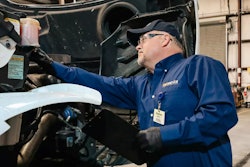 Transervice technician at work on a truck