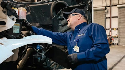 Transervice technician at work on a truck