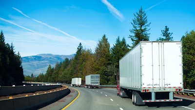 Trio of trailers on highway