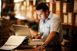 Warehouse worker on a laptop