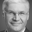 A headshot of Wilfried Aulbur, senior parter at Roland Berger