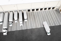 Trucks pulling into loading docks.