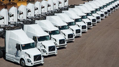 Group of trucks prepared for sale with Ritchie Bros.