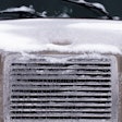 Truck hood covered in snow