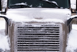 Truck hood covered in snow