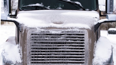 Truck hood covered in snow