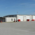 A picture of a truck service center with four service bays.
