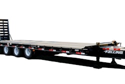 A large black trailer with wood decking.