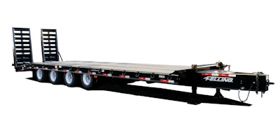 A large black trailer with wood decking.