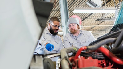 Two technicians working together