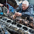 diesel mechanic working on an engine