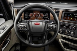 The instrument panel of a new Peterbilt truck with the controls for lane assist technology.