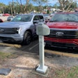 Two 2022 F-150 Ford Lightnings at Coggins Ford in Deland, Florida.